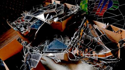 Shattered glass is all the remains of a church's stained-glass windows after Beirut's August 4 explosion.