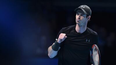 Britain's Andy Murray celebrates winning the first set against Switzerland's Stan Wawrinka during their round robin stage men's singles match on day six of the ATP World Tour Finals tennis tournament in London on November 18, 2016. / AFP / Glyn KIRK