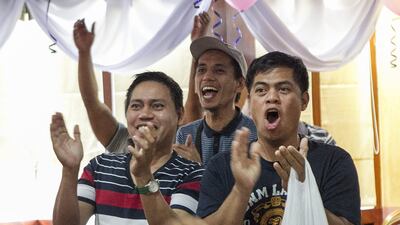 Fans at the Philippine House Restaurant in Abu Dhabi cheer Manny Pacquiao’s world title win over Timothy Bradley. Mona Al Marzooqi / The National