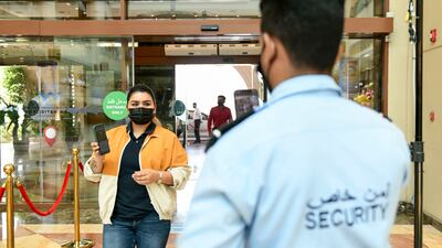 Al Hosn app was introduced to keep track of people's vaccination records and PCR test results during the pandemic. Khushnum Bhandari / The National