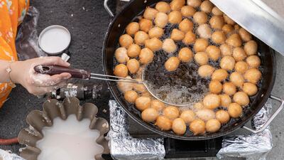 Luqaimat being fried at Union Day celebrations at Bloom World Academy. Antonie Robertson/The National