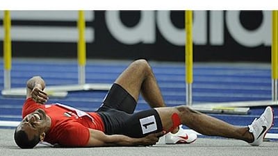 Ali Obaid Al Shirook lies on the floor after suffering a thigh injury during his 400m hurdles heat.