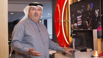 Eyad Al Kourdi, the head of MasterCard in the UAE, demonstrates the cards they have launched in South Africa which can receive payments from the government. Clint McLean for The National