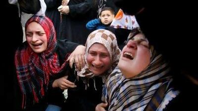 Palestinian women react during the funeral of Ayoub Assaleya, 12, who was killed in an Israeli air strike Sunday.