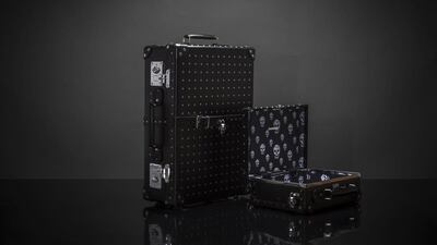 The 21-inch trolley case and a 13-inch mini utility case from Alexander McQueen and Globe-Trotter. Courtesy Alexander McQueen