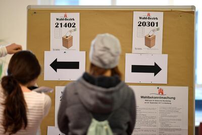 Voters in Hamburg enter a polling station for the German general election on September 24, 2017. Fabian Bimmer / Reuters