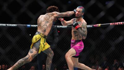 Marlon Vera lands a right hand on Sean O'Malley, right, during their UFC bantamweight title bout at UFC 299 at Kaseya Center on March 09, 2024 in Miami, Florida. Getty