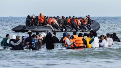 Migrants board a smuggler's boat in an attempt to cross the English Channel, off Gravelines, northern France. AFP