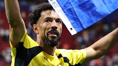 Goalkeeper Vozinha waves the Cape Verdean flag after a draw match against Spain in Atlanta. EPA