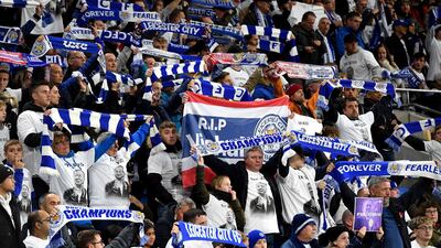Leicester City fans wearing Vichai Srivaddhanaprabha shirts that read 'The Boss' and waving their scarves in remembrance of the Leicester City chairman and victims of the helicopter crash dduring the English Premier League soccer match between Cardiff City and Leicester City at the Cardiff City Stadium, Cardiff. Wales.AP