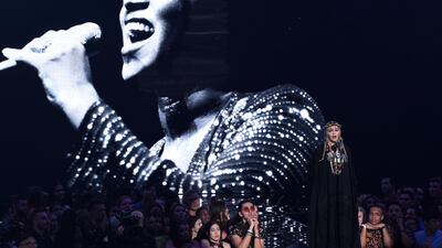 Madonna presents a tribute to Aretha Franklin, pictured on screen, at the MTV Video Music Awards at Radio City Music Hall AP