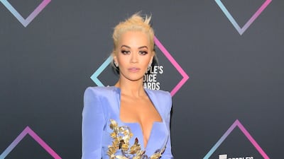 Rita Ora opted for a sharp-shouldered Versace. Photo / AFP