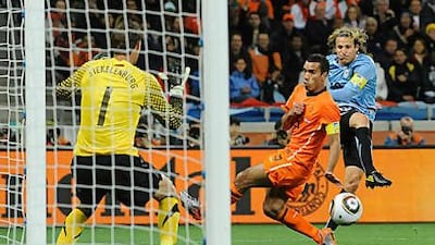Diego Forlan, right, is Uruguay's top scorer at the tournament with four goals.