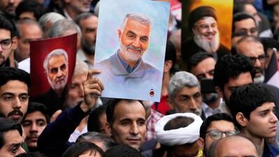 Iranian demonstrators hold up posters of Qassem Suleimani and Hezbollah leader Hassan Nasrallah, who was killed in an Israeli air strike in Beirut in September 2024, at a rally outside the former US Embassy in Tehran, in November 2024. AP