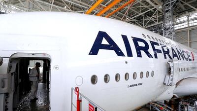 An employee works in an Airbus A380 plane inside the Air France KLM maintenance hangar. Philippe Wojazer / Reuters