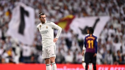 Gareth Bale looks on during the Spanish league defeat to Barcelona at the Santiago Bernabeu stadium on March 2. He was whistled off in the second half. AFP