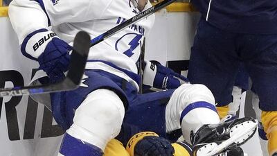 Tampa Bay Lightning centre Brian Boyle lands on Nashville Predators defenceman Roman Josi during the third period on November 21, 2016, in Nashville, Tennessee, USA. Mark Humphrey / AP
