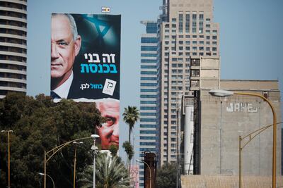A Blue and White party election campaign banner depicting its leader, Israeli Defence Minister Benny Gantz, alongside Israeli Prime Minister Benjamin Netanyahu in Tel Aviv ahead of Israel's election on March 23, 2021. Reuters