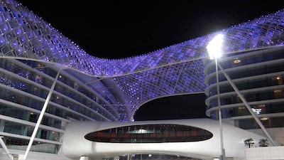 30th October. 2009. ABU DHABI GRAND PRIX. World champion Jenson Button on his second practice round last night as he passes past the Yas hotel. Stephen Lock / The National