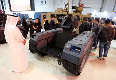 Visitors at Idex in Abu Dhabi look at the Themis weapons system. Chris Whiteoak / The National