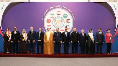 Mohammed Shia Al Sudani poses with ministers and delegates from the region attending the anti-drug trafficking conference in Baghdad on Monday. AFP