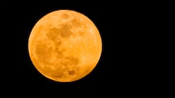 The Moon rises over Skopje in North Macedonia on Tuesday during the total lunar eclipse. EPA
