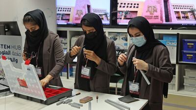 Some of their teammates remain in Afghanistan while others flew to Mexico and the UAE. But the nine girls in Qatar meet after school to work on their entries for the First Global Challenge robotics competition.