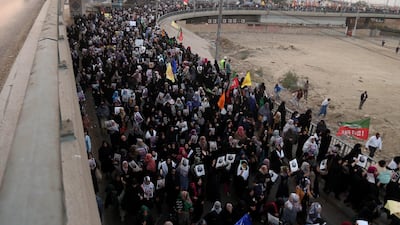 Pakistani Shiite Muslims hold pictures of General Qassem Suleimani during a protest against the USA, in Karachi, Pakistan. EPA