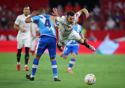Oussama Idrissi is fouled by Rayo Vallecano's Mario Suarez during his brief stint at Sevilla. Getty Images