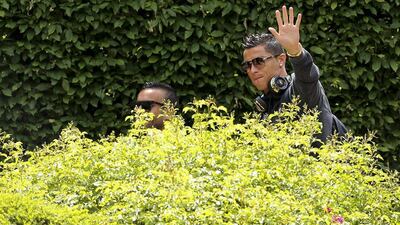 Portuguese player Cristiano Ronaldo waves to the fans upon the team’s arrival to their hotel in Saint-Etienne, France, 13 June 2016. Portugal will play Iceland in the Uefa Euro 2016 on 14 June. Miguel A Lopes / EPA
