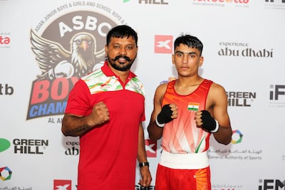 Raveen with his coach Dinesh Brijwasi. Pawan Singh / The National