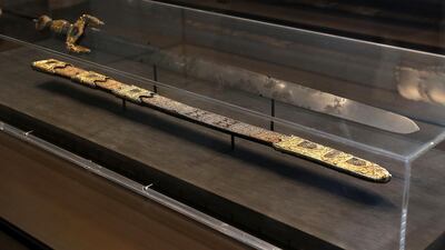 Sword of Boabdil, the last emir of the Nasrid kingdom of Granada, Toledo, Spain (1475-1525): Boabdil swords are named after Muhammad XII of Granada, the last Nasrid sovereign of Granada in Iberia (Boabdil is the Spanish name), who was defeated by Isabella of Castile and Ferdinand of Aragon in 1492. The blade, whose solid silver handle is embedded with beautiful coloured cloisonné enamel and gold filigree, is strikingly long, a violent reminder that these artefacts once had real-world purpose. But the real star is the leather scabbard, which is embroidered with intricate silver thread and bears the Nasrid motto, “There is no victor but God”. Photo: Pawan Singh / The National