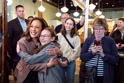 Democratic presidential nominee Vice President Kamala Harris, left, takes a photo with patron during a campaign visit to Pittsburgh on September 7. AP