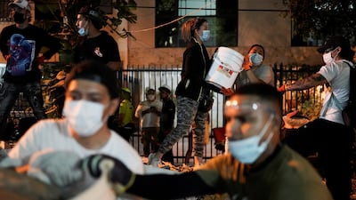 Rescuers and volunteers at the site of a collapsed building in Cali. Reuters