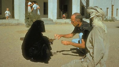 Dr Pat Kennedy treats a woman at the original hospital compound, circa 1961. Courtesy of Brooks Glett / Oasis Hospital