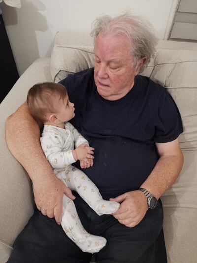 Granddad tells granddaughter a story at bedtime. Katy Gillett / The National