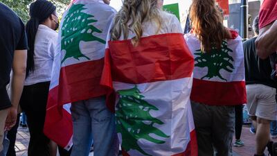 Demonstrators wrapped in Lebanese flags during a rally in Lafayette Park near the White House. EPA