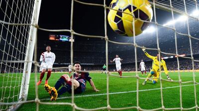 Lionel Messi of Barcelona scores his team's fourth goal, and his second goal of the game, in their 5-1 win over Sevilla on Saturday night. The goal broke Telmo Zarra's La Liga goalscoring record. David Ramos / Getty Images
