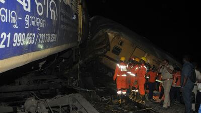 Rescuers search for survivors. AP