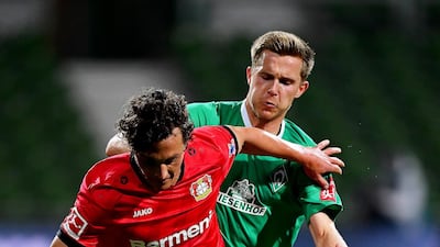 Johannes Eggestein (back) of Bremen in action against Julian Baumgartlinger (front) of Leverkusen during the German Bundesliga soccer match between SV Werder Bremen and Bayer 04 Leverkusen in Bremen, Germany. EPA