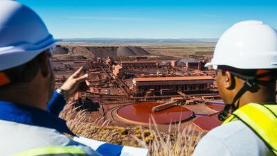 Visitors look out towards the iron ore processing plant at the Sishen open cast mine, operated by Kumba Iron Ore Ltd., an iron ore-producing unit of Anglo American Plc, in Sishen, South Africa, on Tuesday, May 22, 2018. Kumba Iron Ore may diversify into other minerals such as manganese and coal as Africa’s top miner of the raw material seeks opportunities for growth and to shield its business from price swings. Photographer: Waldo Swiegers/Bloomberg