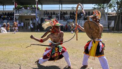 Manggarai men perform during a Caci, a ritual whipping fight, in Surabaya, East Java, Indonesia. AFP