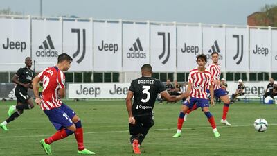 Atletico Madrid's Alvaro Morata scores their second goal in a friendly against Juventus. EPA