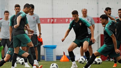 Portugal's Cristiano Ronaldo, left, plays the ball with teammates during Portugal's official training on the eve of the group B match between Portugal and Morocco at the 2018 soccer World Cup, in Kratovo, outskirts Moscow, Russia, on June 19, 2018. Francisco Seco / AP Photo