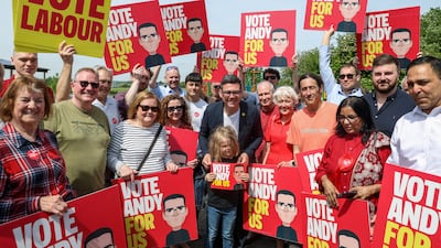 Greater Manchester Mayor and Labour candidate Andy Burnham poses with supporters during his campaign launch, ahead of the Makerfield by-election triggered by the resignation of Labour MP Josh Simons, in Ashton-in-Makerfield, Britain. Reuters