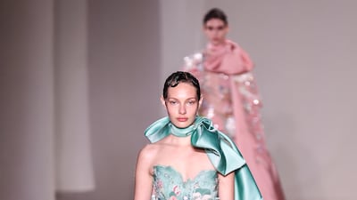 The Elie Saab spring 2023 haute couture show offered this feathered gown in seafoam green. EPA