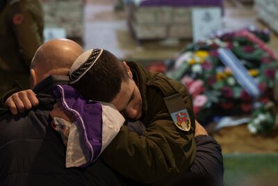 Family and friends of Israeli reservist Nicholas Berger during his funeral at Mt Herzl military cemetery in Jerusalem on Wednesday. AP