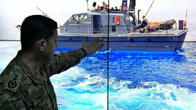 Col Haitham Dinnawi, commander of the Lebanese navy, shows the Lebanese navy boat which was attempting to force a small vessel with migrants to turn back to the shore before it sank, during a press conference in Beirut. AP