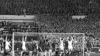 Jackie Charlton of Leeds United, right, raises his arms in celebration after scoring his team's first goal during the FA Cup final against Chelsea at Wembley Stadium. Getty