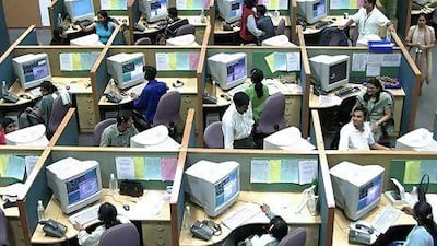 A call centre in Bangalore. India's IT sector is the main beneficiary of a weak rupee that has plunged more than 20% in recent months. Jagadeesh NV / Reuters